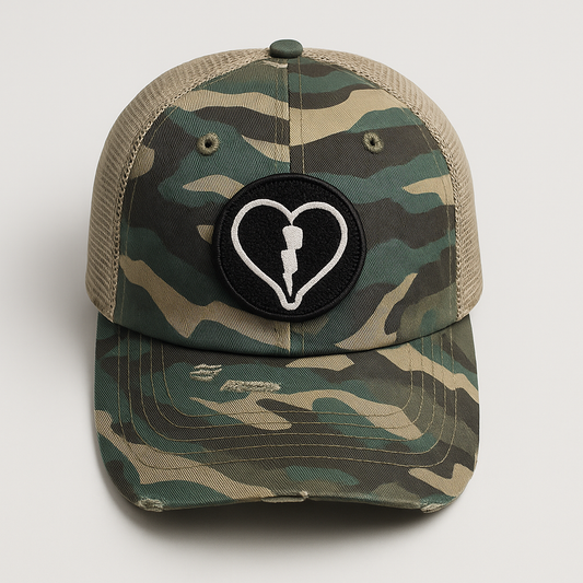 Distressed camo mesh back cap featuring the official Liveblackheart chenille heart and lightning bolt logo, lifestyle streetwear brand Every Heart Has A Story.