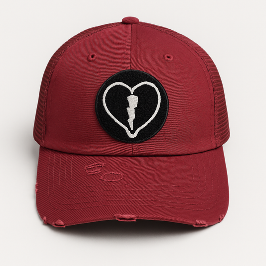 Distressed garnet mesh back cap featuring the official Liveblackheart chenille heart and lightning bolt logo, lifestyle streetwear brand Every Heart Has A Story.