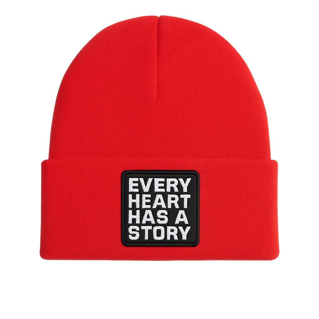 Red beanie with a patch that says 'Every Heart Has a Story' on a white background