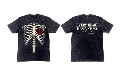 A dark washed black t-shirt shown from both the front and back. The front features a graphic of a white rib cage with a red heart in the center.
