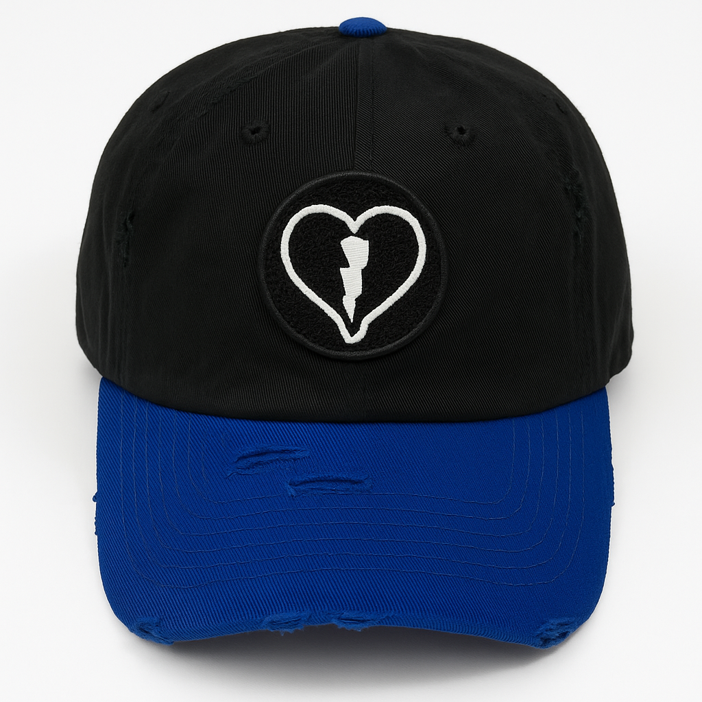 Distressed black and royal blue cap featuring the official Liveblackheart chenille heart and lightning bolt logo, lifestyle streetwear brand Every Heart Has A Story.